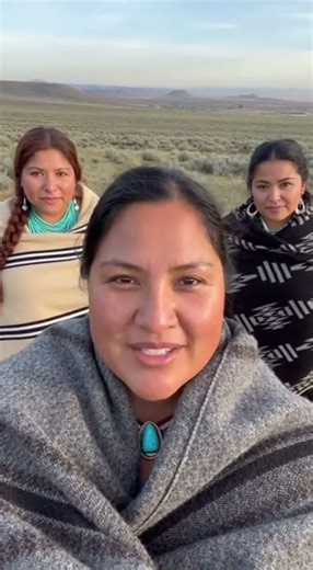 Foreground woman speaks gently with friendly gestures