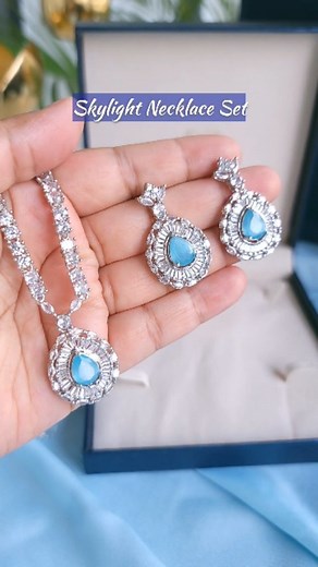 769 reactions · 15 shares | Inspired by the vast limitless blue sky, the Skylight necklace set is all about serenity and Zen  The gorgeous blue stone is symbolic of the endless sky and the shining American diamonds flawlessly blend with it just like the bright sky melts into a dusky starry night. A perfect amalgamation of luxury and class, this is one piece you must own. Available exclusively on Blingvine.com #blingvine #necklace #earrings #blue #jewelry | Blingvine | Facebook