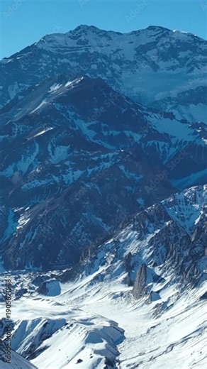 Aconcagua, a mountain in the Andes Mountains between Chile and Argentina. Aerial view in vertical video.