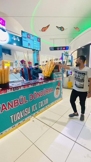 Fun Turkish Ice Cream Vendor Dancing to Delight Customers