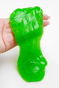 💚🟢 It’s gooey. It’s stretchy. It’s BRIGHT GREEN. This DIY slime is the kind of craft that kids go absolutely feral for—and honestly? We get it. 😆✨ https://onelittleproject.com/green-slime/ | One Little Project