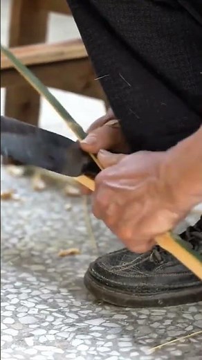 Sharpening a bamboo stick using a sharp knife carefully