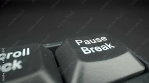 Closer look of the Pause Break key of the keyboard and pressing it once
