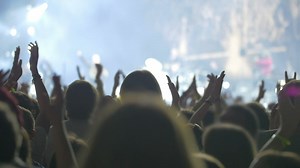 Man standing still in an excited crowd - Free Stock Video