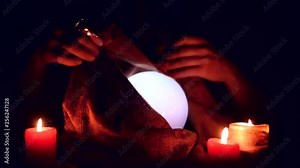 Fortune teller is reading the future with a crystall ball on his table. Stock Video