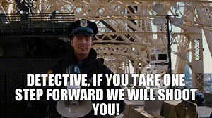 Detective, if you take one step forward we will shoot you!