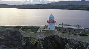 Aerial of the Rotten Island Lighthouse with Killybegs in Background - County Donegal - Ireland Stock Footage - Video of rock, coast: 161571742