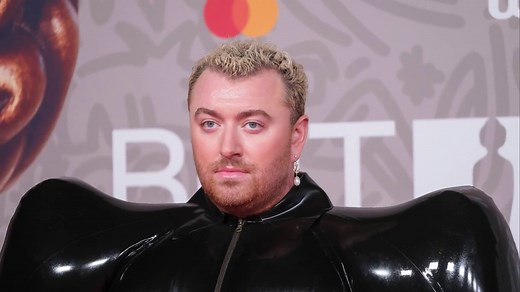 Sam Smith wears inflatable latex look at Brit Awards