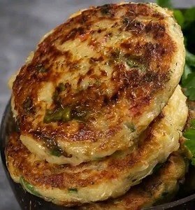 Tuna Fish Cakes . Ingredients: 2 cans (5 oz each) tuna in water, drained 1 cup breadcrumbs (plus extra for coating) 2 large eggs 1/4 cup mayonnaise 1 tablespoon Dijon mustard 2 green onions, finely chopped 1/4 cup red bell pepper, finely diced 1 tablespoon fresh parsley, chopped 1 clove garlic, minced Zest of 1 lemon Salt and pepper to taste 2 tablespoons olive oil (for frying) Directions: In a large bowl, combine tuna, breadcrumbs, eggs, mayonnaise, Dijon mustard, green onions, red bell pepper,