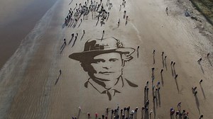 Volunteers and members of the local community gathered on West Sands Beach in St. Andrews to create a portrait of Dr. Elsie Inglis and commemorate her contribution to the country during the First World War. Here's a birds eye view of the portrait they made. | National Theatre of Scotland