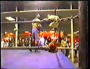 Vintage wrestling was brutal-Wrestler cuts his opponent's face with a knife and leaves him bloody.