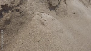 Close up tidal waves hitting fine sand mediterranean shore