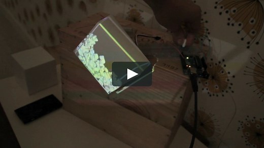 Virtual rocks colliding with an interactive cardboard box