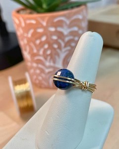 Learn how to create this elegant wrap ring using one bead, wire and a few simple tools. Watch it here on our YouTube channel: https://bit.ly/3y1rYCh JTV Alicia Herzbrun | Jewel School