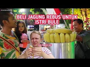 PLAYING IN BLORA SQUARE WHILE BUYING BOILED CORN