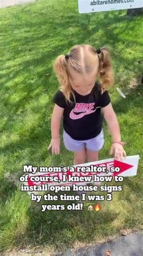 Open house sign installation by toddler