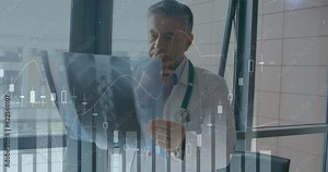 Animation of multiple graphs with changing numbers over caucasian doctor examining x-ray of patient