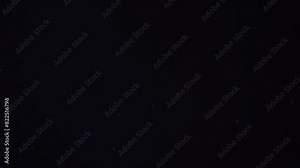 The movement of dust particles and dust particles, the effect of dynamics. Isolated black background, overlay layout for your design. High quality 4k footage