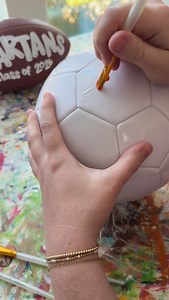 3.9K views · 46 reactions | Paint and personalize a soccer ball with me! These are a perfect senior gift and make a precious keepsake. Tag a soccer parent! #smallbusinessowner #paintingvideo #personalizedgift #soccermom #paintedsoccerball | The Redheaded Camel | Facebook