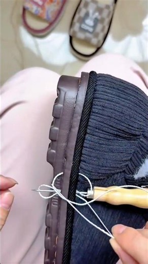 Repairing A Thick Sole Shoe Using A Hand Sewing Awl And White Thread