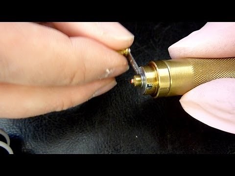 How to fit a watch mainspring into the barrel using Bergeon winders. Watch repairing techniques.