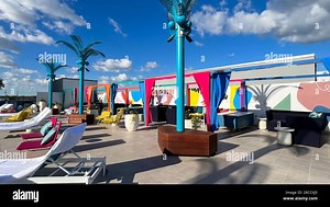 Orlando, FL USA -  December 23 2021: The outdoor amenities with a swimming pool, cabanas and lounge chairs at the Wave Hotel at Lake Nona in Orlando Stock Photo - Alamy