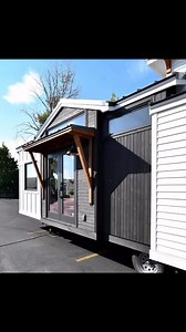 38ft Cascade MaxThis Cascade Max is a custom tiny home that was built for a couple in Washington State. Their transition from their traditional home was smooth. They decided to sell their home to their daughter and place their new tiny home on the property. With dimensions of 38×10.5ft, it offers spacious living. The addition of a deck upon delivery enhances outdoor living, blending nature with modern comfort seamlessly. It has a huge kitchen, spacious living room, and a queen bed in the master 