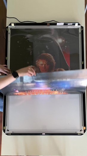 Iconic Star Wars Movie Posters Displayed in Lightboxes