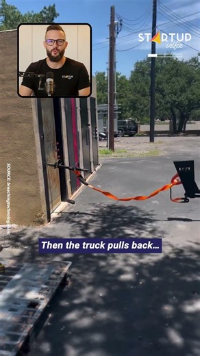 Watch how a truck-mounted breaching tool removes the entire door.