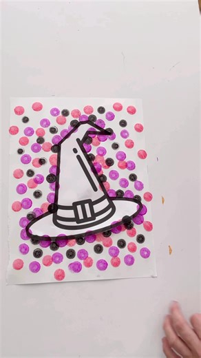 Try this simple and fun Halloween art idea! Take an outline of something Halloween themed and gently tape it from underneath (I use painters tape so it doesn’t rip) to another piece of paper. Use dot markers to dot all around the outline and beyond. Remove the top paper and admire! For links to the dot markers we love, check the first comment! #halloweenart #kidsartsandcrafts #halloweencraftsforkids | Stay at Home Activity Mom