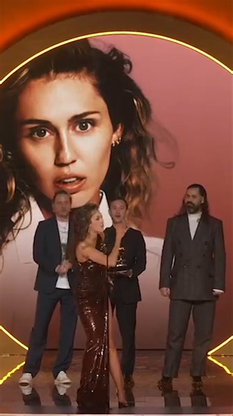 Oh, to be one of Miley Cyrus' MAIN GAYS 😌💐 Congratulations on your well-deserved #GRAMMYs wins 🏆 | Logo