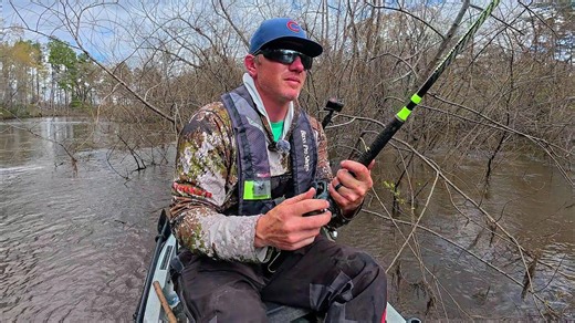 Kayak fishing on a flooded river