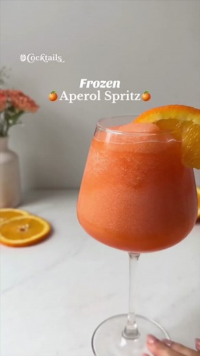 This Frozen Aperol Spritz tastes like summer in a glass! 🌞🍊 It's everything you love about the classic cocktail, blended with ice & garnished with an orange slice✨ Tag someone who loves Aperol Spritz!🧡 #frozenaperolspritz #frozen #aperol #spritz #orange #prosecco #frozencocktails #summercocktails #cocktailsIngredients: -Handful of ice -2 oz. Aperol -2 oz. orange juice -2 oz. prosecco -Orange slices for garnish