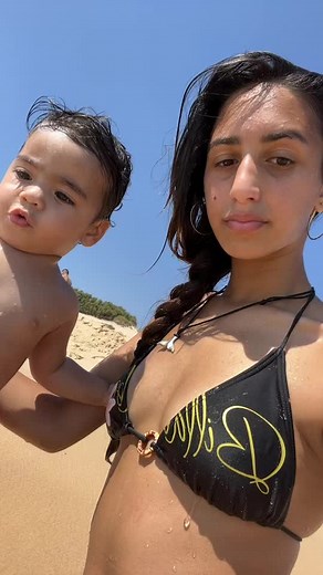 Beach Day Fun: Mother and Child Enjoy Sunshine Together