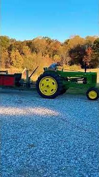 1964 New Idea 202 manure spreader pulled with a 1952 John Deere 50 tractor.