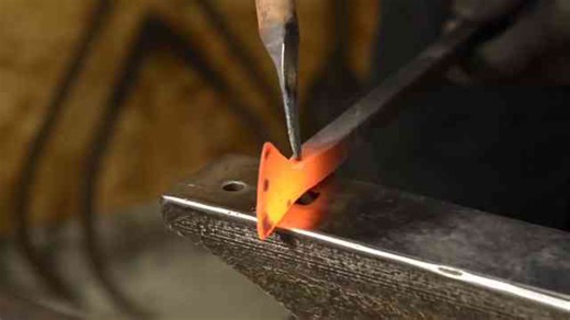Forging a custom axe pendant by hand
