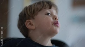 Child showing tongue misbehaving kid sticking tongue out