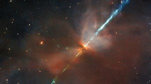 Hubble captures a superheated gas jet streaking across space