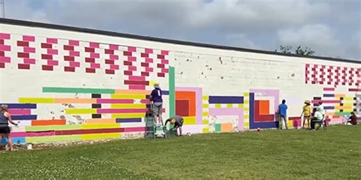 Local artists paint mural on the Margaret Walker Alexander Library