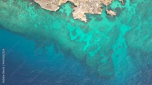 Beautiful aqua and turquoise waters, with coral reef patterns in the ocean. View from drone, on vacation. Marine life, global warming, protection, island. Philippines