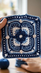 This blue crochet granny square features a beautifully layered design with textured stitches and a balanced geometric pattern 🧶✨ #grannysquare #crochetsquare #crochetmotif #classiccrochet #crochetinspiration | Theworldcrochet