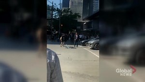 Video shows cyclist and driver get into physical confrontation in downtown Toronto intersection