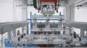 Automated machine. Automated assembly line. Robotic equipment. Modern factory floor. Conveyor line. Industrial factory.