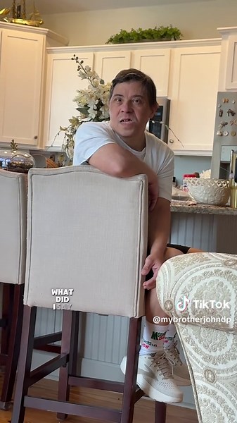 John thought he heard me say a cuss word… and immediately went into full investigation mode. 😂 If you know me, you know those words are not used in my vocabulary. But then John remembered Hopie made him a burger earlier… and suddenly the investigation was completely abandoned so he could eat it at 3 o’clock sharp. 🍔 Priorities! Life with my brother with Down syndrome is never boring. One minute he’s the language police… the next minute he’s focused on his next snack. Follow for more funny sibl