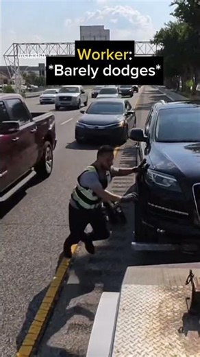 Tow worker dodges incoming car