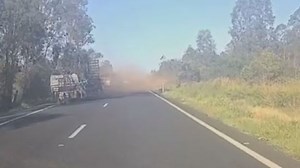 Watch: Drivers ‘shocked’ as trailer crashes across median strip