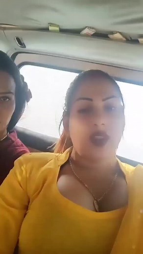 Stylish Women Sharing Fashion Tips in a Car