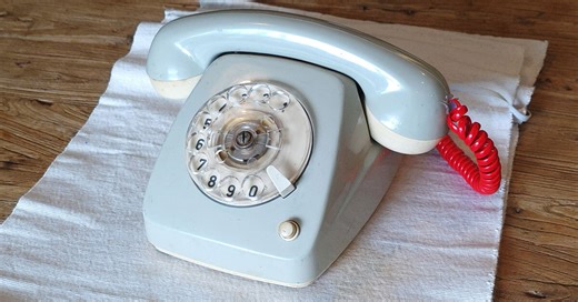 vintage rotary telephone transforms into analog-digital hybrid music player and AI voice chat