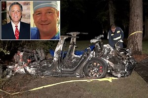 Police and firefighters at the scene of auto-pilot Tesla car crash in Woodlands, Texas