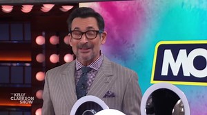 Kelly Clarkson models her slimmer figure in a pink belted dress